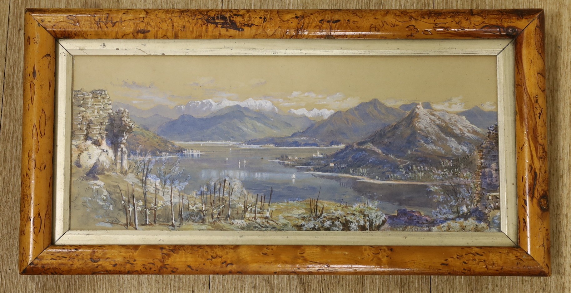 19th century Colonial School, watercolour, Extensive lake and mountain scene, 14 x 34cm